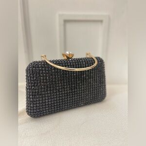 Elegant Black and Gold Clutch Bag